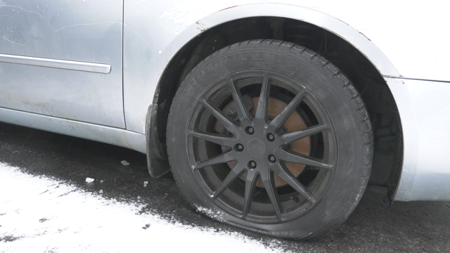 A photo of a car that has been keyed and had a tire slashed, taken on Mon., Dec. 4 (Christian D'Avino/CTV News). 