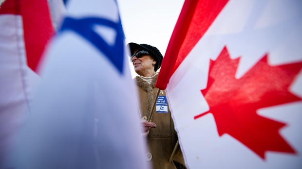 People gather following a demonstration in support of Israel and the release of hostages, in Toronto, Sunday, Nov. 12, 2023. THE CANADIAN PRESS/Christopher Katsarov