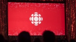The CBC logo is projected onto a screen in Toronto on May 29, 2019. (THE CANADIAN PRESS/Tijana Martin)