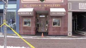 Police tape is seen outside a downtown Collingwood, Ont., jewelry store where police say an armed robbery took place on Mon., Dec. 4, 2023. (CTV News/Mike Arsalides)