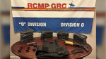 RCMP said a search of a property near Ottawa led to the seizure of guns, a bulletproof vest and drugs. (RCMP/handout)