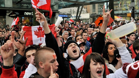 Canadian supporters cheer after Canada's gold medal victory against the USA during the final hockey match at the Vancouver 2010 Olympics in Vancouver, British Columbia, Sunday, Feb. 28, 2010. 