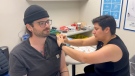 People are rolling up their sleeves to get vaccinated at Shoppers Drug Mart on Dec. 8, 2023 (Katelyn Wilson/CTV News)