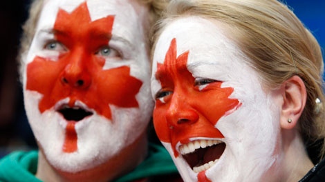 Fans cheer before the start of the men's gold medal ice hockey game between Canada and USA at the Vancouver 2010 Olympics in Vancouver, British Columbia, Sunday, Feb. 28, 2010. (AP Photo/Gene J. Puskar)