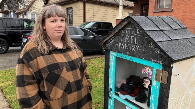 Audrey Hill in front of her Little Free Pantry. (Sijia Liu/CTV Kitchener)