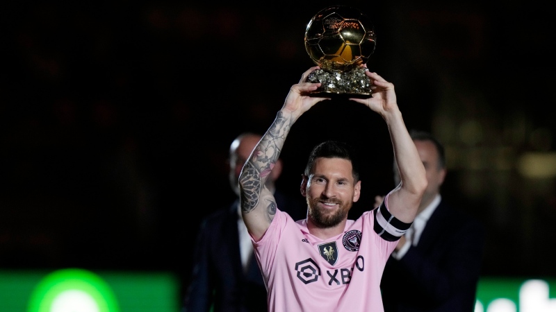 Inter Miami forward Lionel Messi holds his Ballon d'Or trophy before a club friendly soccer match against New York City FC, Friday, Nov. 10, 2023, in Fort Lauderdale, Fla. (AP Photo/Lynne Sladky)