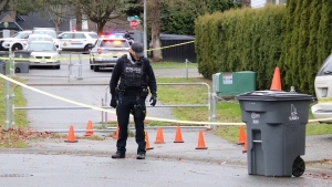 A police officer investigates at the scene of a shots fired incident in Guildford on Friday, Dec. 29. 