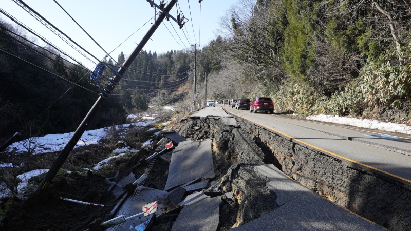 A partially collapsed road affected by landslide caused by a powerful earthquake is seen near Anamizu Town, Ishikawa Prefecture, Tuesday, Jan. 2, 2024.  (AP Photo/Hiro Komae)