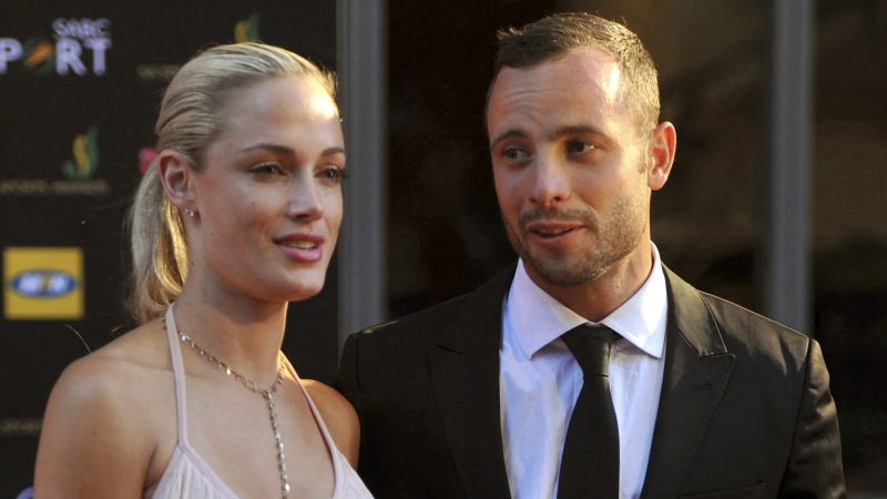 South African Olympic athlete Oscar Pistorius, right, and his girlfriend, the late Reeva Steenkamp, left, arrive at an awards ceremony in Johannesburg, South Africa. Nov. 4, 2012. (Lucky Nxumalo/Citypress via AP, File)