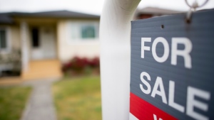 A real estate sign is pictured in Vancouver, B.C., Tuesday, June, 12, 2018.  (THE CANADIAN PRESS Jonathan Hayward) 