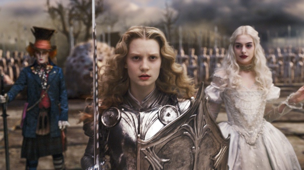 From left, Johnny Depp, Mia Wasikowska and Anne Hathaway are shown in a scene from Walt Disney Pictures' 'Alice in Wonderland.'