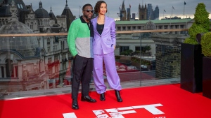 Kevin Hart, left, and Gugu Mbatha-Raw pose for photographers upon arrival at the photo call of the film 'Lift' on Thursday, Jan. 11, 2024 in London. (Scott A Garfitt/Invision/AP)