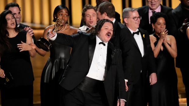 Matty Matheson, center, and the team from 'The Bear' accept the award for outstanding comedy series during the 75th Primetime Emmy Awards on Monday, Jan. 15, 2024, at the Peacock Theater in Los Angeles. (AP Photo/Chris Pizzello)