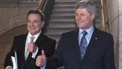 Finance Minister Jim Flaherty (left) and Prime Minister Stephen Harper signal thumbs up in the foyer of the House of Commons prior to Flaherty delivering the budget on Parliament Hill in Ottawa on Thursday, March 4, 2010. (Pawel Dwulit  / THE CANADIAN PRESS)