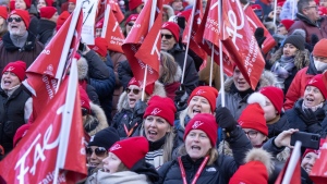 Striking teachers and their supporters hold a rally in front of Premier François Legault's office, Friday, Dec. 22, 2023 in Montreal. (THE CANADIAN PRESS/Ryan Remiorz)