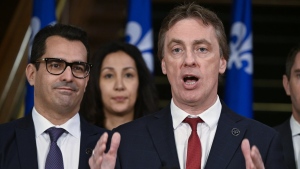 Quebec Liberal Party interim Leader Marc Tanguay speaks at a news conference as the fall session comes to an end, Friday, December 8, 2023 at the legislature in Quebec City. Quebec Liberal House Leader Monsef Derraji, left, looks on. THE CANADIAN PRESS/Jacques Boissinot