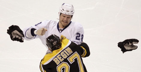As gloves fly, Boston Bruins left wing Steve Begin (27) tussles with Toronto Maple Leafs right wing Colton Orr, rear, during the third period of an NHL hockey game in Boston, Thursday, March 4, 2010. (AP/Charlie Krupa)