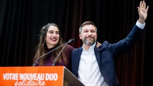 Current co-leader Gabriel Nadeau-Dubois, right, and newly elect Émilise Lessard-Therrien are seen on stage following Lessard-Therrien's election victory as the new co-spokesperson of the Quebec Solidaire party at their convention in Gatineau, Que. on Sunday, Nov.26, 2023. THE CANADIAN PRESS/Spencer Colby