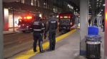 Calgary police investigate a stabbing aboard a downtown CTrain on Sunday, Dec. 17, 2023. 