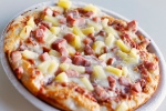 <b>Hawaiian pizza</b><br><br>

The controversial pie was invented in 1962 by Greek-Canadian cook and businessman Sam Panopoulos, in Southwestern Ontario. (Jill Brady / Portland Press Herald)

