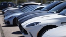 A long line of unsold 2023 luxury sports-utility vehicles and coupes sits at an Aston Martin dealership Sunday, Aug 27, 2023, in Highlands Ranch, Colo. AP, David Zalubowski