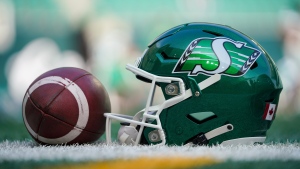 A Saskatchewan Roughriders helmet sits on the field before pre-season CFL football action against BC Lions in Regina, on Saturday, May 27, 2023. THE CANADIAN PRESS/Heywood Yu