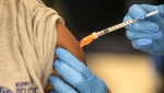 A student receives a vaccine in a file photo. (AP Photo/Ted Jackson, File)