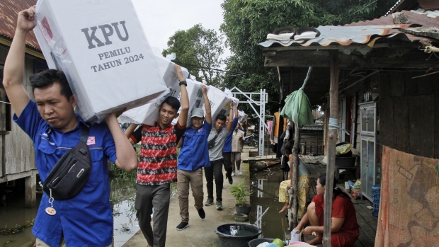 Electoral workers carry ballot boxes during the distribution of election paraphernalia to remote villages, in Pemulutan, South Sumatra, Indonesia, Tuesday, Feb. 13, 2024.<br><br>
Indonesia, the world's third-largest democracy, will open its polls on Wednesday, Feb. 14, to nearly 205 million eligible voters in presidential and legislative elections. Workers have been using motorbikes, horses and boats to distribute the ballot boxes to remote areas.<br><br>
(AP Photo/Muhammad Hatta)
