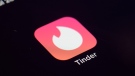 FILE - The icon for the dating app Tinder appears on a device, July 28, 2020, in New York. Tinder, Hinge and other dating apps are designed with addictive features that encourage “compulsive” use, a proposed class action lawsuit against parent company Match Group claims. (AP Photo/Patrick Sison, File)