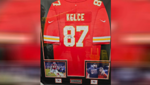 Travis Kelce's jersey signed by the tight end and his superstar girlfriend Taylor Swift. (Source: Twitter/Helen Loftin)