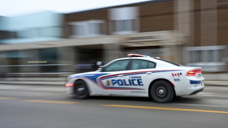 A police car drives by London Police Headquarters in London, Ont. on Monday, Jan. 29, 2024. (THE CANADIAN PRESS/Geoff Robins)