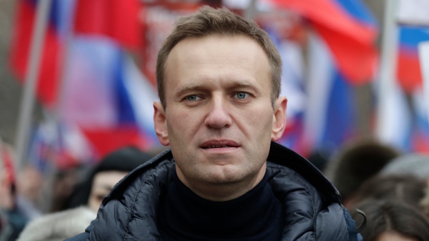 In this Sunday, Feb. 24, 2019 file photo, Russian opposition activist Alexei Navalny takes part in a march in memory of opposition leader Boris Nemtsov in Moscow, Russia.  (AP Photo/Pavel Golovkin, File)