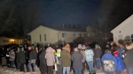 People gathered outside a Carman home remembering five homicide victims from the area. (Source: Jared Delorme/APTN) Uploaded Feb. 17, 2024 