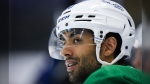 Vancouver Canucks' Arshdeep Bains waits for an on-ice session to begin during the opening day of the NHL hockey team's training camp, in Victoria, Thursday, Sept. 21, 2023. THE CANADIAN PRESS/Darryl Dyck