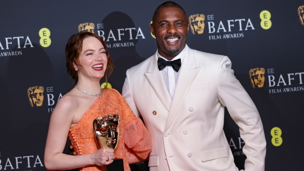 Emma Stone, left, winner of the leading actress award for 'Poor Things', and Idris Elba pose for photographers at the 77th British Academy Film Awards, BAFTA's, in London, Sunday, Feb. 18, 2024. (Photo by Vianney Le Caer/Invision/AP)