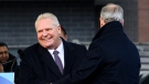 Ontario Premier Doug Ford joins Finance Minister Peter Bethlenfalvy, before making an announcement at a press conference in Mississauga, Ont., Tuesday, February 13, 2024. THE CANADIAN PRESS/Christopher Katsarov 