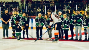 The Seguin and Beaudry families of Timmins dropped the ceremonial puck at a Timmins Rock game in honour of their late son and grandson, Ryan Seguin, who died in 2019 at age 24. Feb. 19/24 (Lydia Chubak/CTV Northern Ontario) 