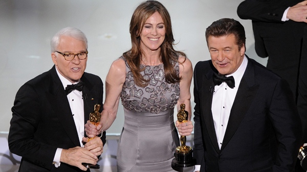 Kathryn Bigelow, centre, holds her Oscars for best motion picture of the year and best achievement in directing for 'The Hurt Locker' with hosts Alec Baldwin, right, and Steve Martin at the conclusion of the 82nd Academy Awards Sunday, March 7, 2010. (AP / Mark J. Terrill)