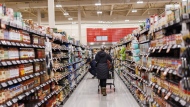 A shopper browses in an aisle at a grocery store In Toronto on Friday, Feb. 2, 2024. THE CANADIAN PRESS/Cole Burston