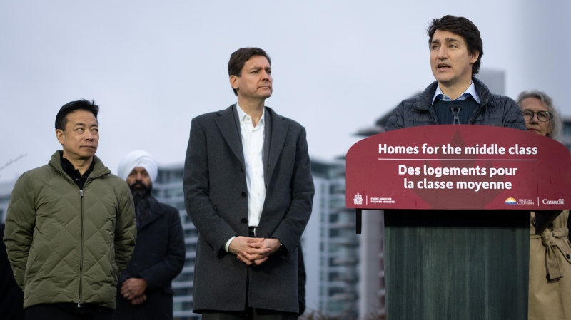 Vancouver Mayor Ken Sim, from left to right and B.C. Premier David Eby listen as Prime Minister Justin Trudeau speaks during a news conference on housing in Vancouver on Tuesday, Feb. 20, 2024 THE CANADIAN PRESS/Ethan Cairns