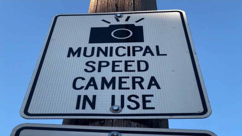 A sign warning drivers that a municipal speed camera is in use along the roadway ahead. (CTV News Ottawa) 