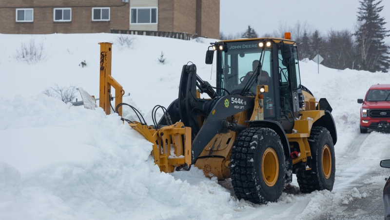 Crews clean up after a winter storm in Sydney, N.S. on Monday, Feb.5, 2024. A local state of emergency remained in effect in parts of Cape Breton on Monday, as Nova Scotia dug out from one of the heaviest snowfalls in 20 years. THE CANADIAN PRESS/Shane Wilkie