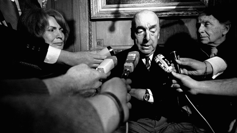 FILE - This Oct. 21, 1971 file photo shows Pablo Neruda, poet and then Chilean ambassador to France, talking with reporters in Paris after being named the 1971 Nobel Prize for Literature. (AP Photo/Laurent Rebours, File)