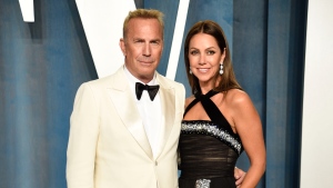 Kevin Costner, left, and Christine Baumgartner arrive at the Vanity Fair Oscar Party, March 27, 2022, in Beverly Hills, Calif. (Photo by Evan Agostini/Invision/AP, File)