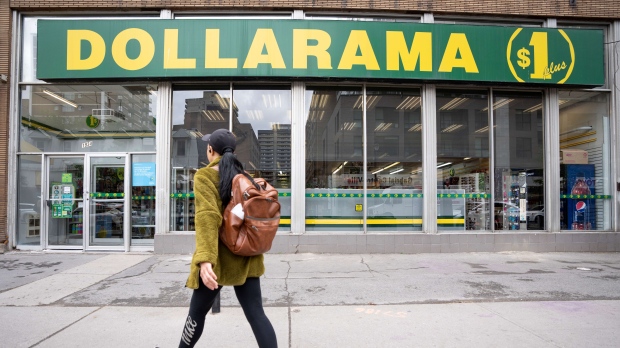 A person walks past a Dollarama store in Montreal, Wednesday, June 7, 2023. THE CANADIAN PRESS/Christinne Muschi