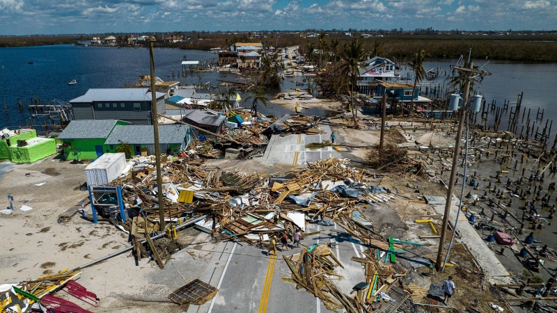 An aerial picture taken on Oct. 1, 2022, shows a broken section of Pine Island Road, debris and destroyed houses in the aftermath of hurricane Ian in Matlacha, Fla. (Ricardo Arduengo/AFP/Getty Images)