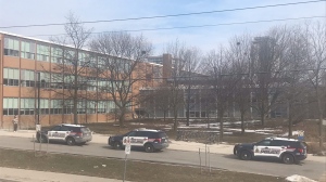 Police cruisers are seen outside Waterloo Collegiate Institute on Feb. 21, 2024. (Chris Thomson/CTV Kitchener)