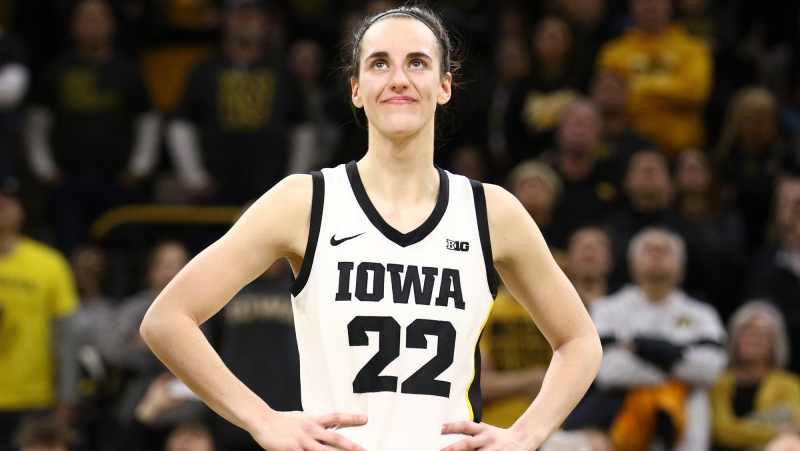 Caitlin Clark of the Iowa Hawkeyes listens as the crowd cheers after breaking the NCAA women's all-time scoring game last week. (Matthew Holst/Getty Images via CNN Newsource)