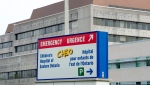 A sign directing visitors to the emergency department is shown at CHEO, Friday, May 15, 2015 in Ottawa. THE CANADIAN PRESS/Adrian Wyld