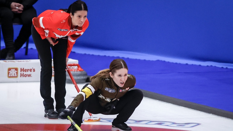 Team Manitoba-Lawes skip Kaitlyn Lawes, right, directs her teammates as Team Canada skip Kerri Einarson looks on at the Scotties Tournament of Hearts in Calgary, Wednesday, Feb. 21, 2024. THE CANADIAN PRESS/Jeff McIntosh